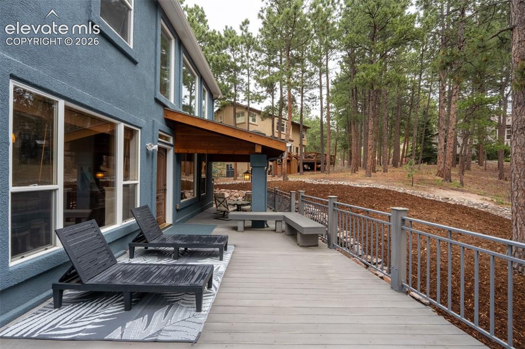 Image 40 of 49: Back deck off living room walk out - half covered/ half uncovered