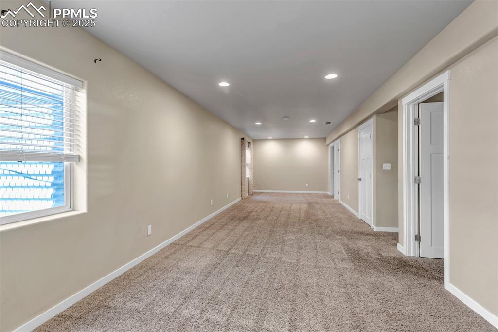 Image 31 of 37: Spare room featuring carpet flooring and recessed lighting