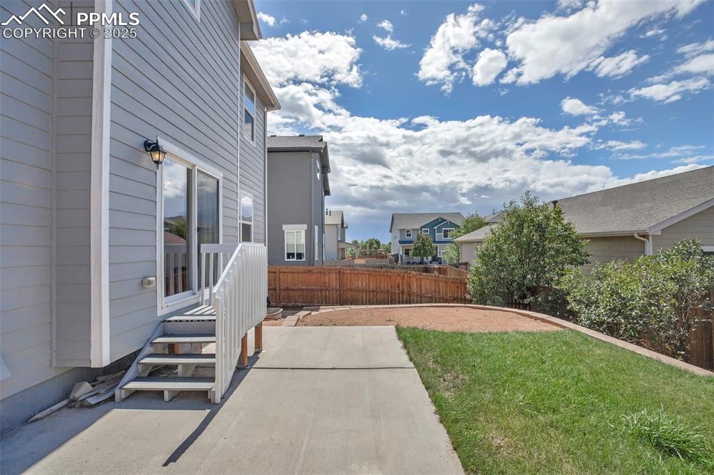 Image 35 of 37: View of yard with a residential view and a patio
