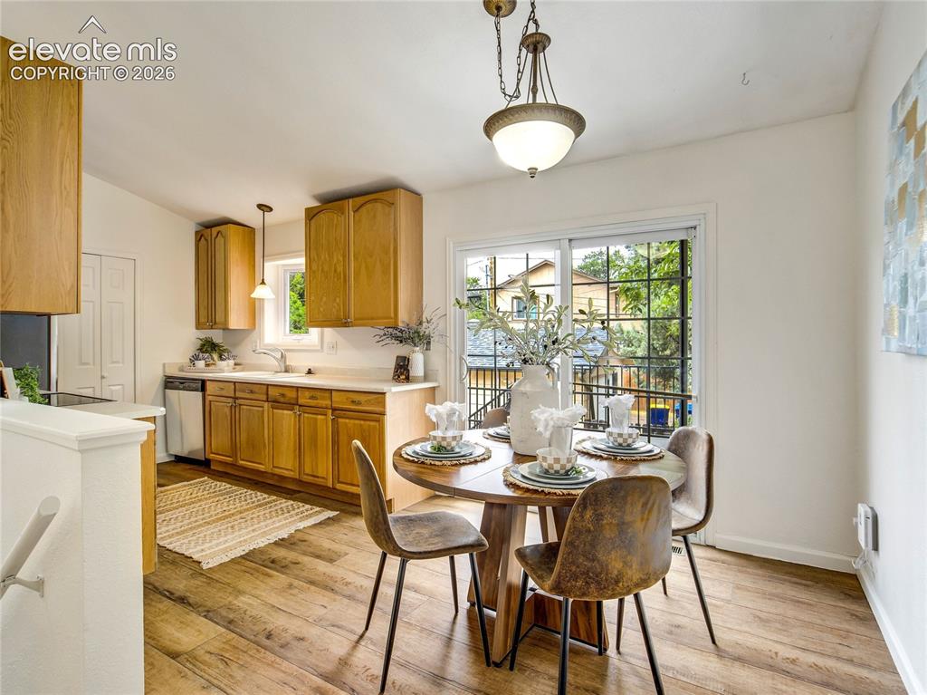Image 10 of 33: The kitchen and dining nook create a practical space for cooking, dining, a