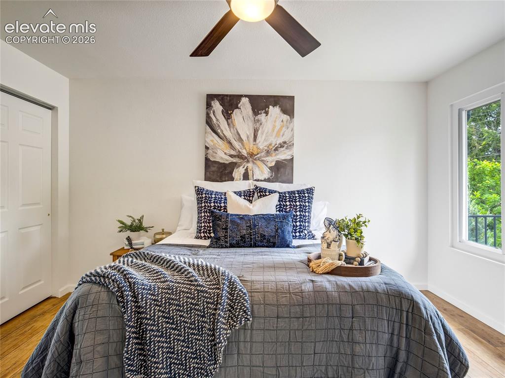 Image 14 of 33: Generous primary suite offers privacy, natural light, and convenient access