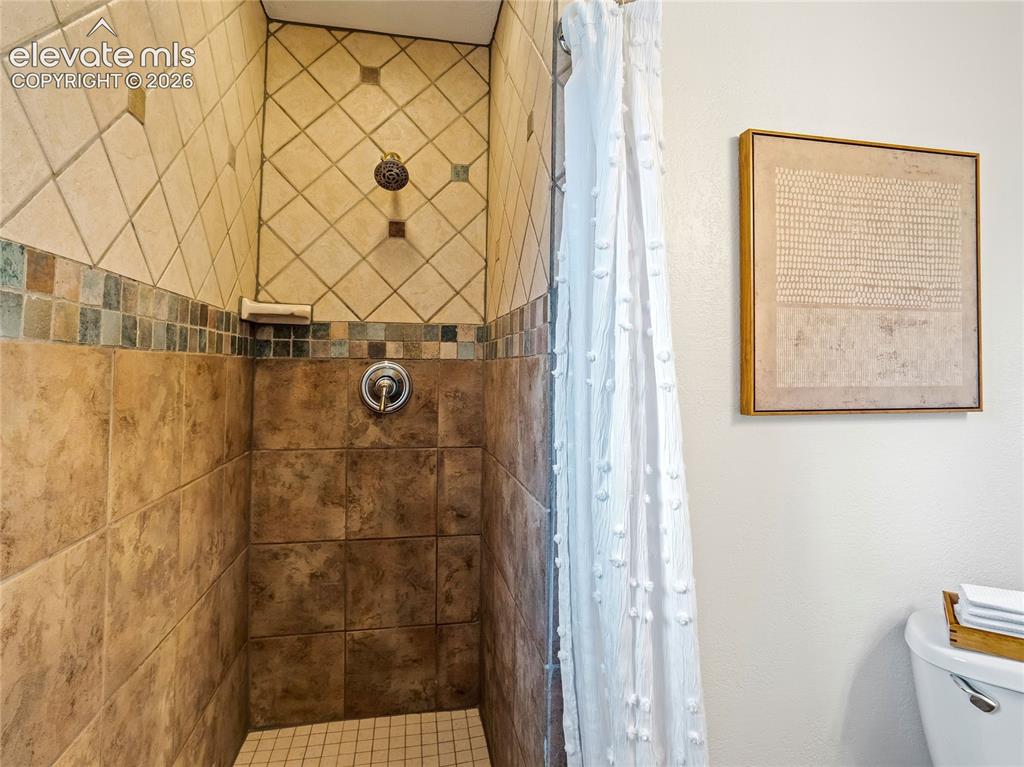 Image 18 of 33: Walk-in shower