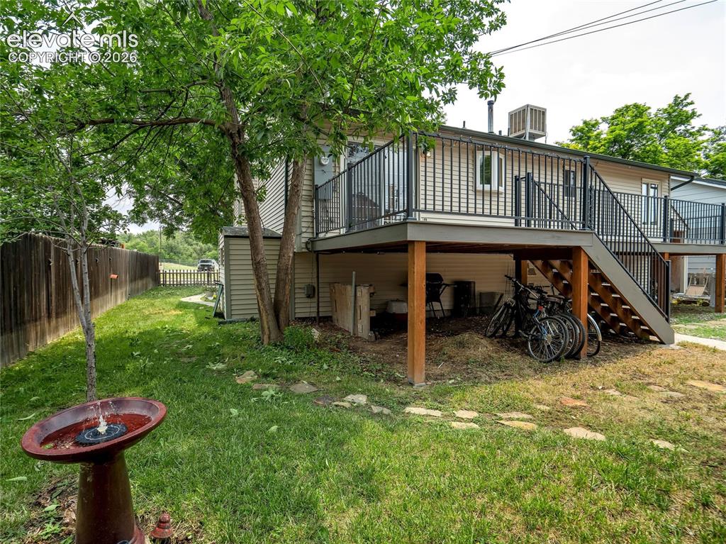 Image 27 of 33: Multiple outdoor spaces invite quiet moments, while under-deck storage adds