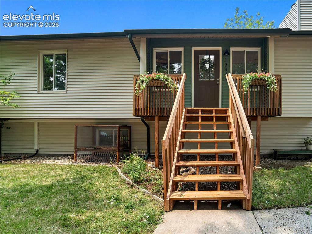 Image 5 of 33: Front steps lead to a covered entry, creating a distinct and private entran