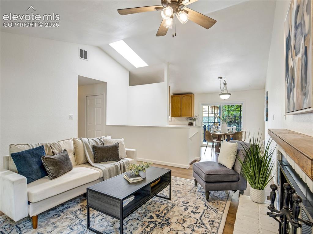 Image 7 of 33: Seamless flow from the living room  to the adjoining living areas