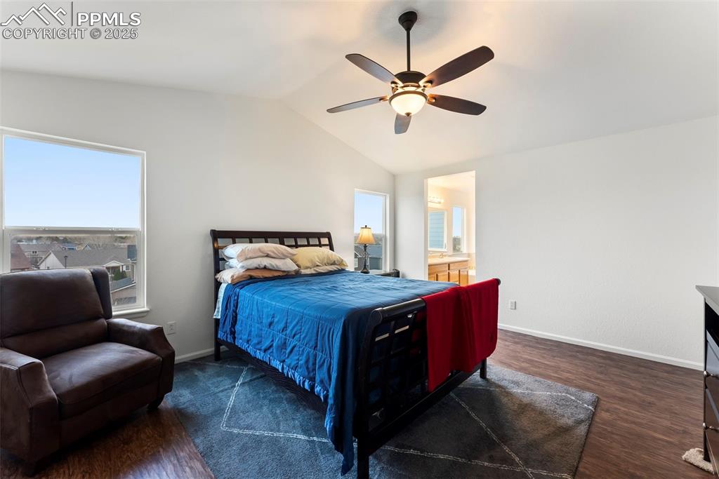 Image 12 of 28: Primary bedroom with vaulted ceiling and open layout