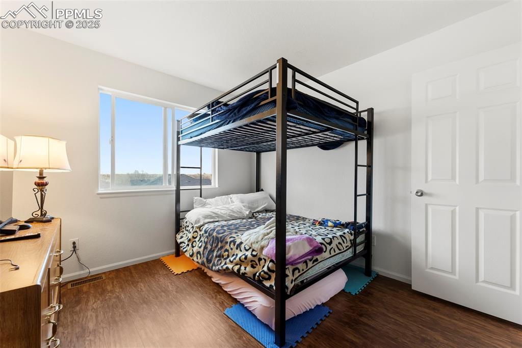 Image 15 of 28: Bright secondary bedroom with ample space