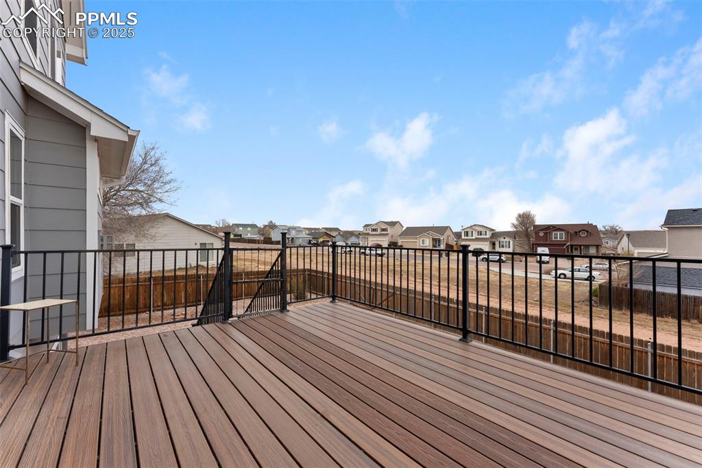 Image 21 of 28: Spacious upper trex deck with open views