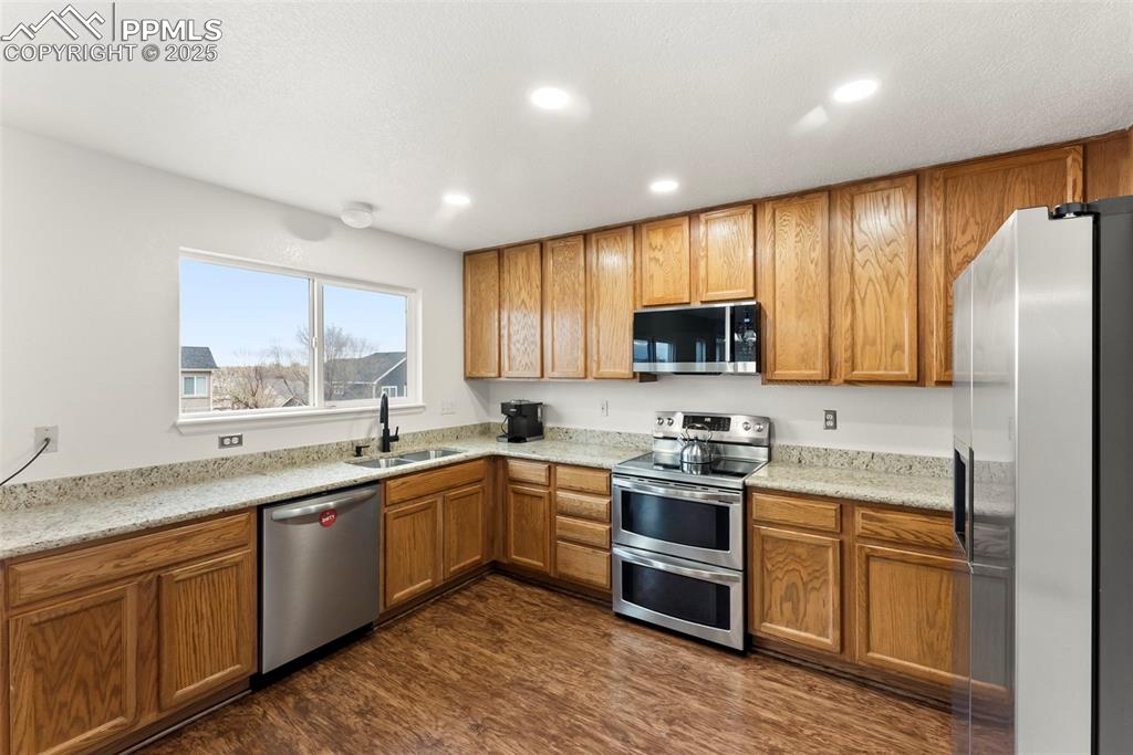 Image 6 of 28: pacious kitchen with ample cabinet storage and stainless appliances.