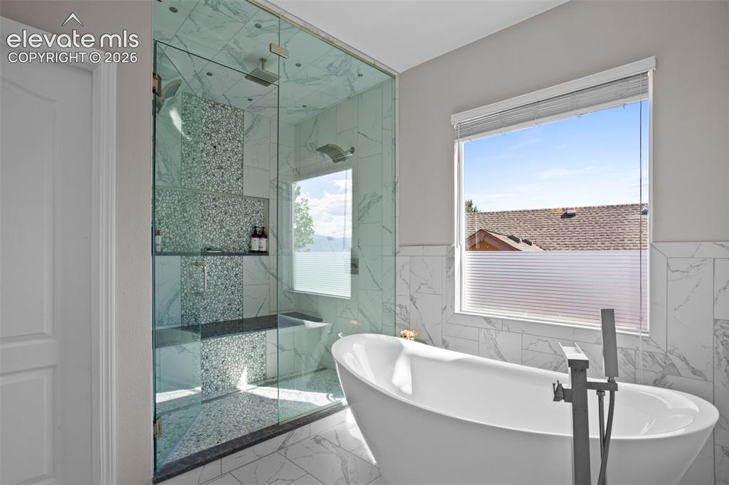 Image 22 of 41: Upper Primary with Steam Room in the Shower and Soaking Tub