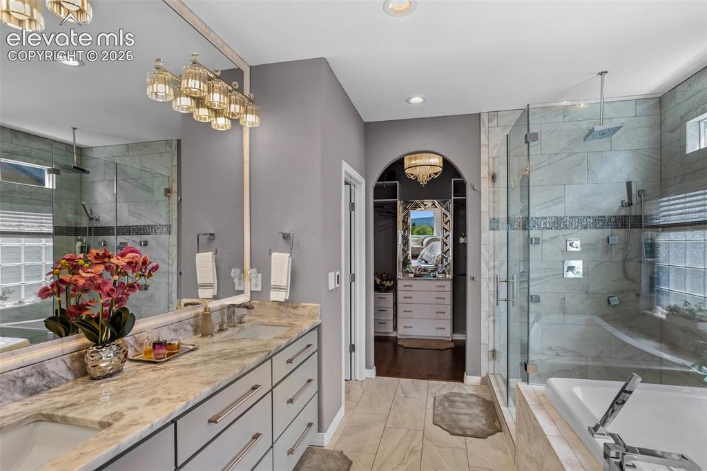 Image 25 of 41: Main-Level Primary Bath with Jetted Tub that keeps the water warm