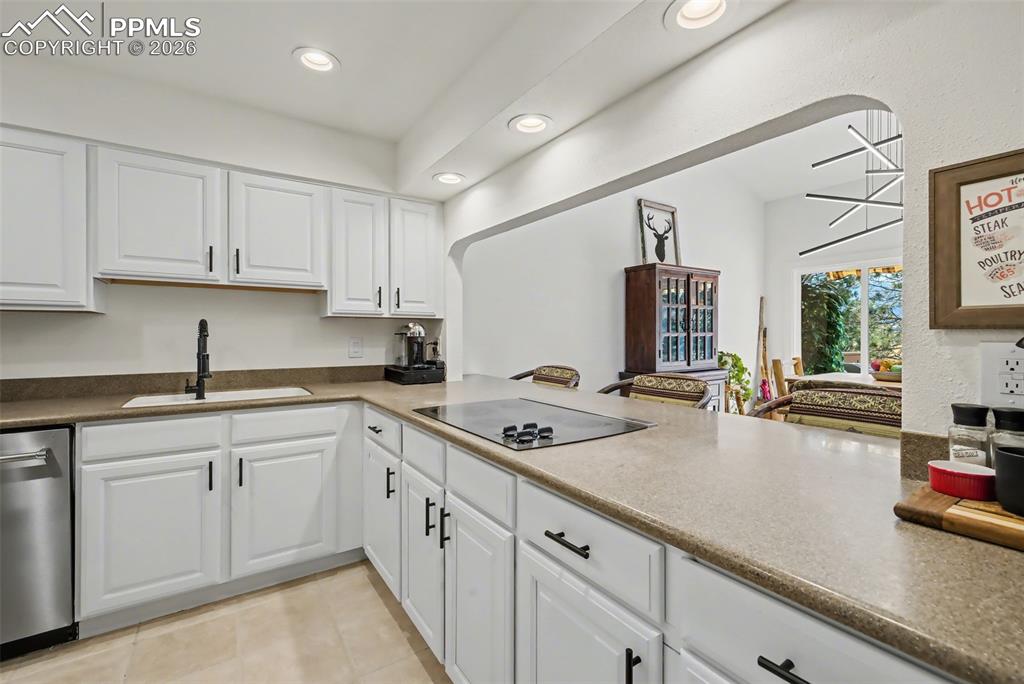 Image 17 of 36: Opens to the dining area with breakfast bar 