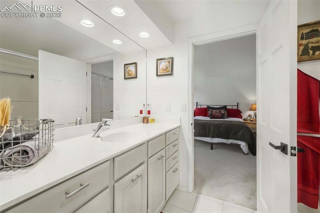 Image 27 of 36: Upper level jack and jill style bathroom