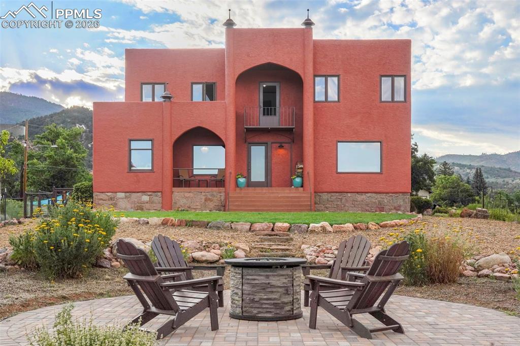 Image 1 of 47: View front from of yard with fire pit and sitting area