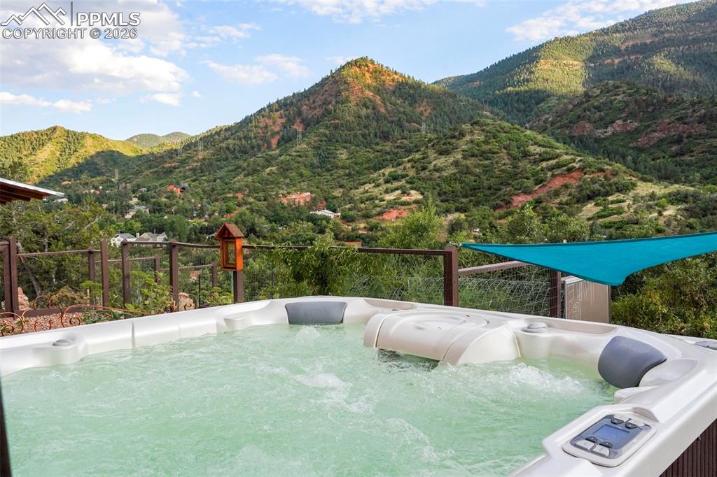 Image 10 of 47: View of hot tub featuring a mountain view and a hot tub
