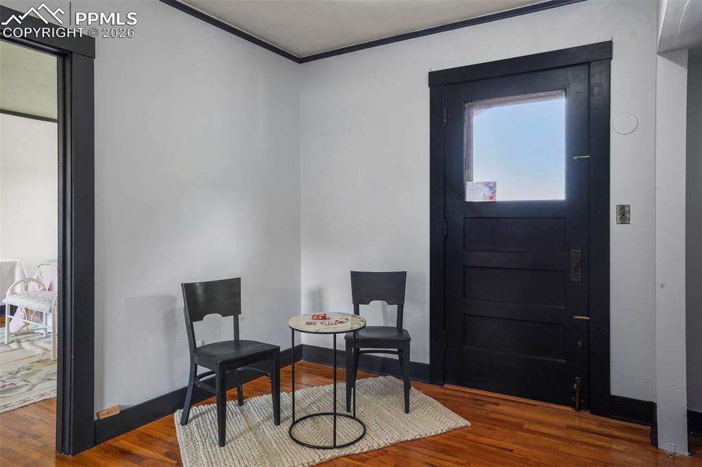 Image 39 of 47: Upper level at top of stairs - door to Juliet Balcony with amazing city vie