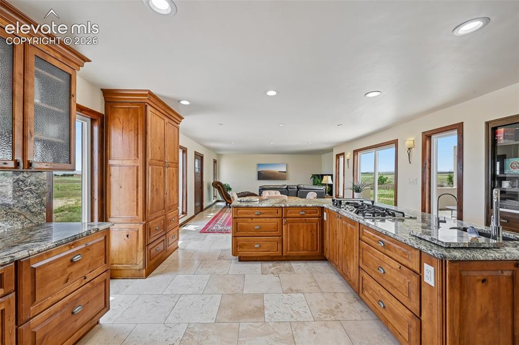 Image 12 of 36: Floors are travertine.