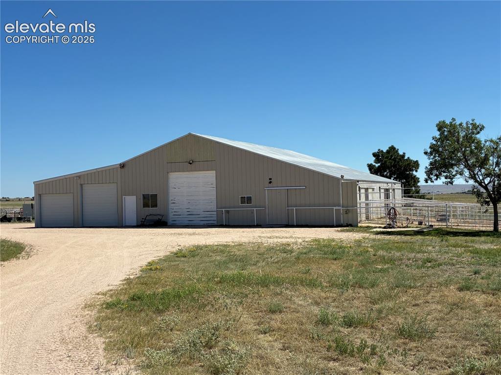 Image 2 of 36: The barn has 6 12x12 stalls, runs with water, shop, office, vehicle parking