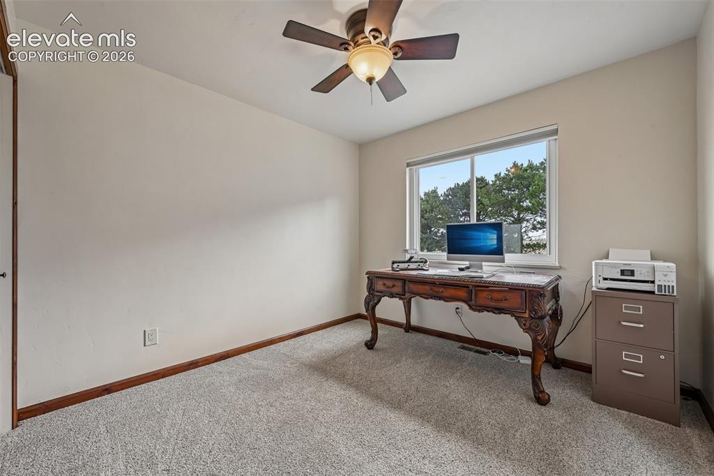 Image 22 of 36: Neutral wall finishes with a ceiling fan light fixture