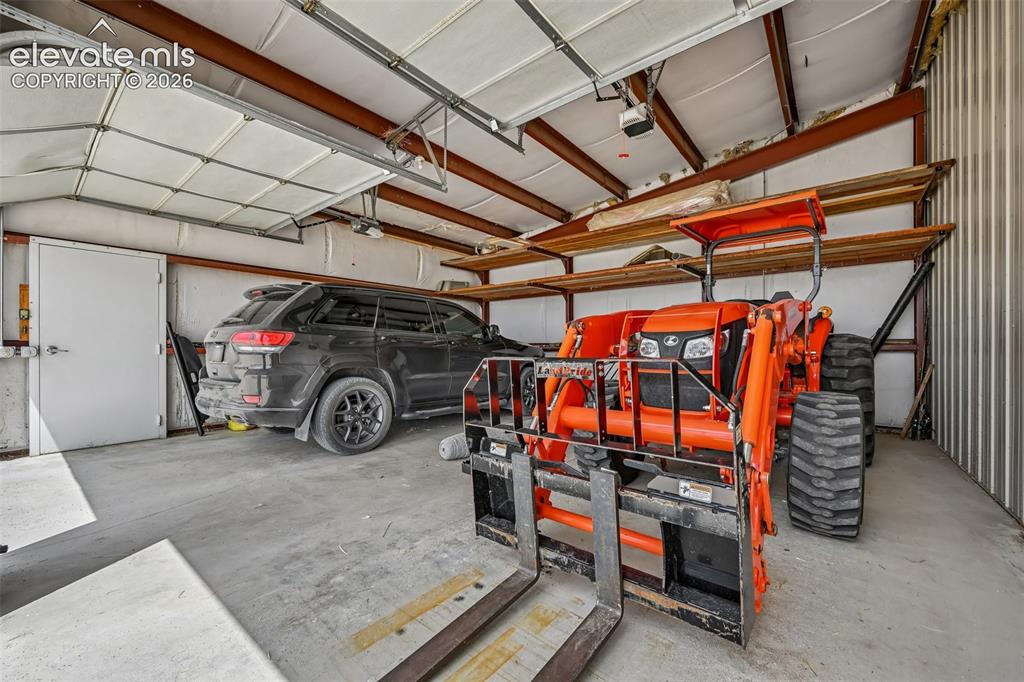 Image 32 of 36: Vehicle storage in the barn.