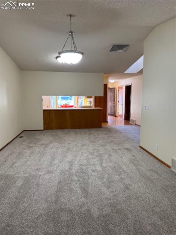 Image 13 of 30: Living Room looking toward the Dining Room New Carpet