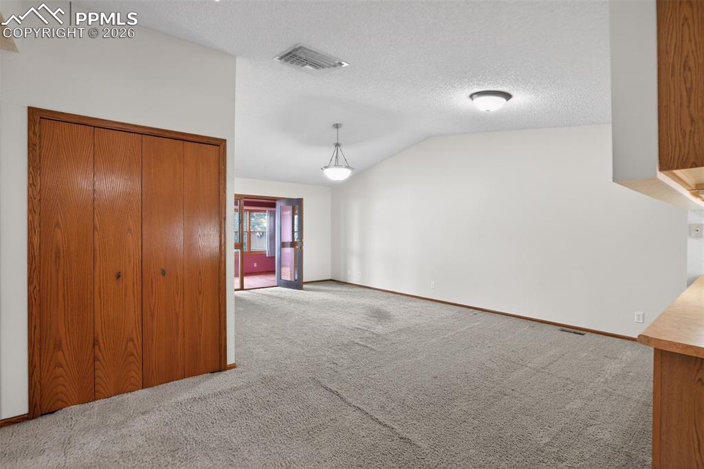 Image 14 of 30: From the Hallway, looking into the Living Room leading to the Bonus Rooom