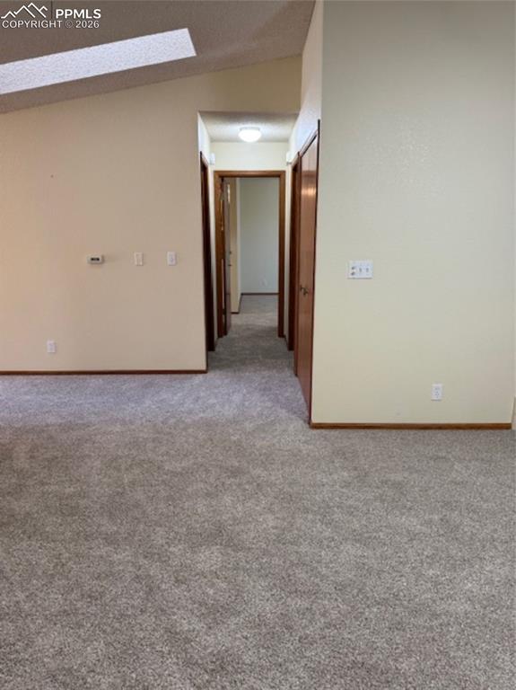 Image 17 of 30: Living Room looking into the hallway - new carpet