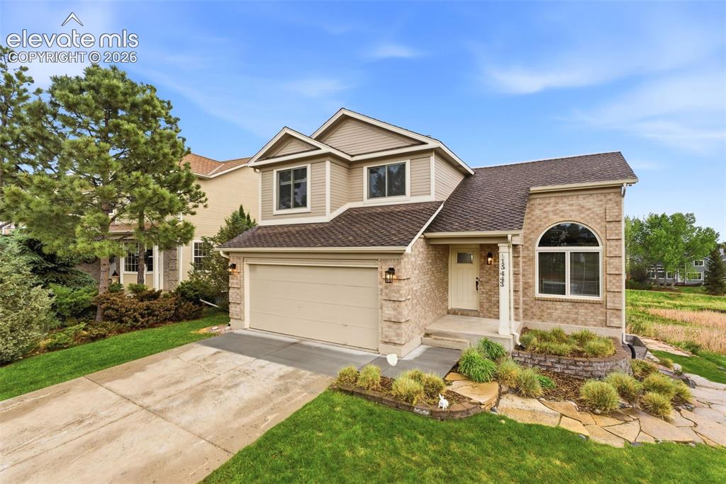 Image 1 of 50: Curb appeal with open space behind