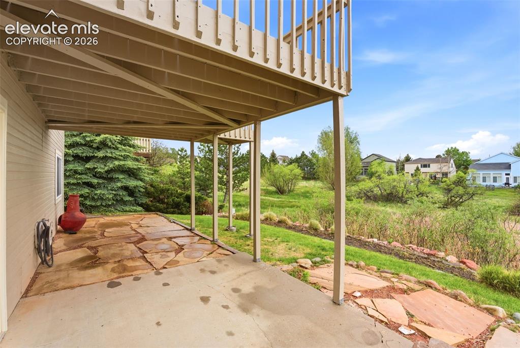 Image 10 of 50: Professionally landscaped with multiple outdoor living spaces