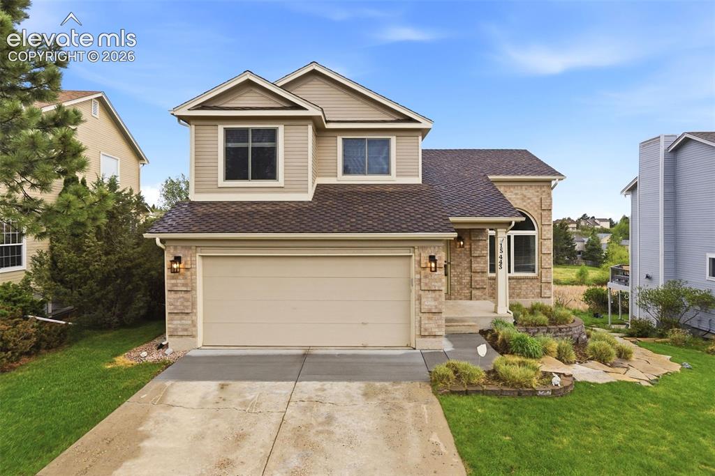 Image 2 of 50: Curb appeal with open space behind