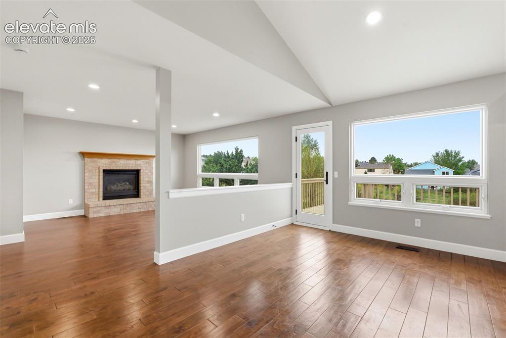 Image 23 of 50: Dining room with walkout to deck and amazing views