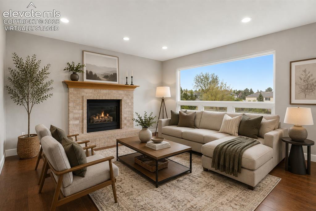 Image 28 of 50: Virtually Staged - Great room with gas fireplace