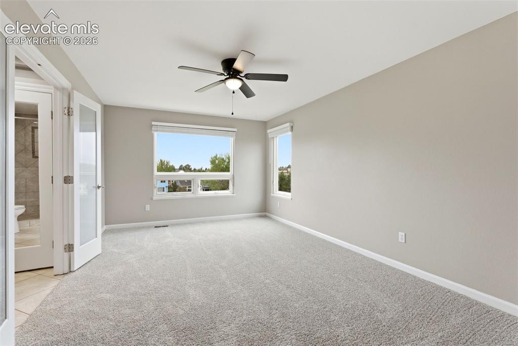 Image 33 of 50: Primary retreat with massive views, upgraded bath, walk-in closet and more.
