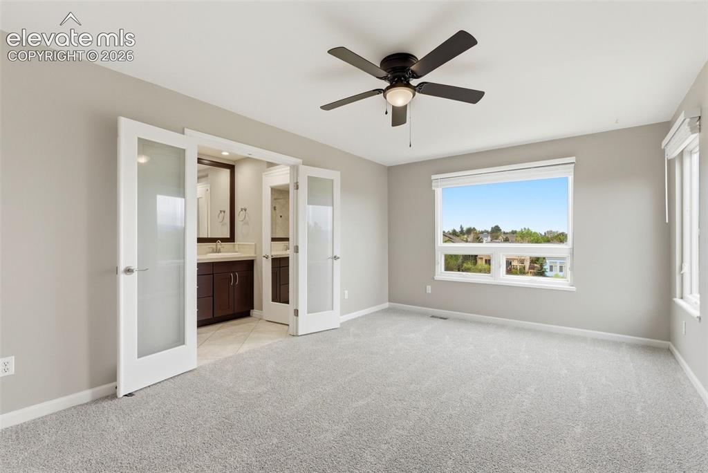Image 34 of 50: Primary retreat with massive views, upgraded bath, walk-in closet and more.