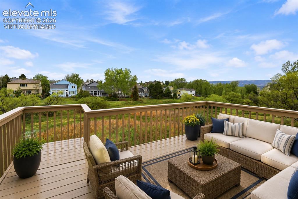 Image 4 of 50: Virtually Staged - Deck with open space and massive mountain views