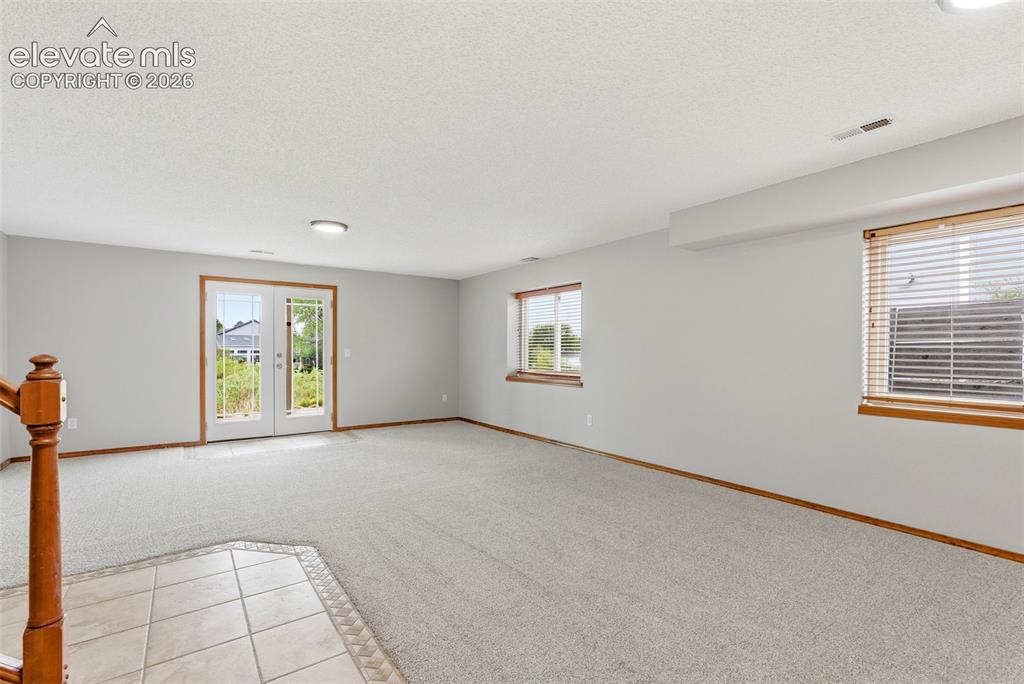 Image 40 of 50: Family Room / Rec Room with walkout to patio