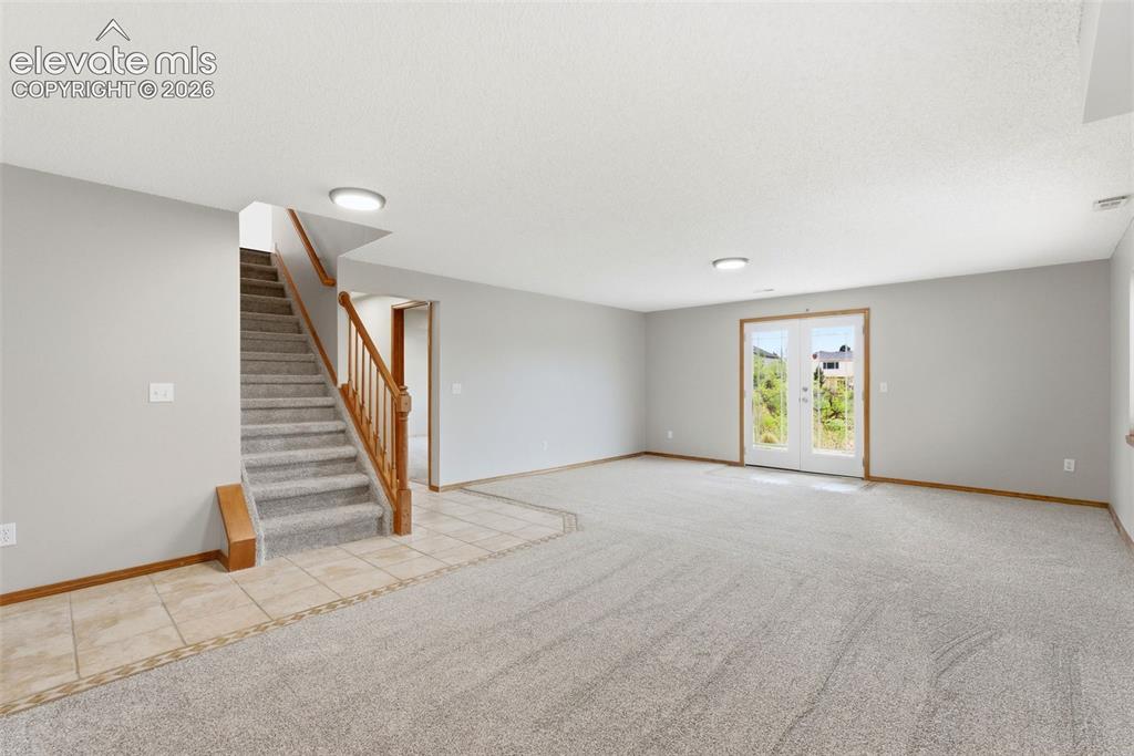 Image 42 of 50: Family Room / Rec Room with walkout to patio
