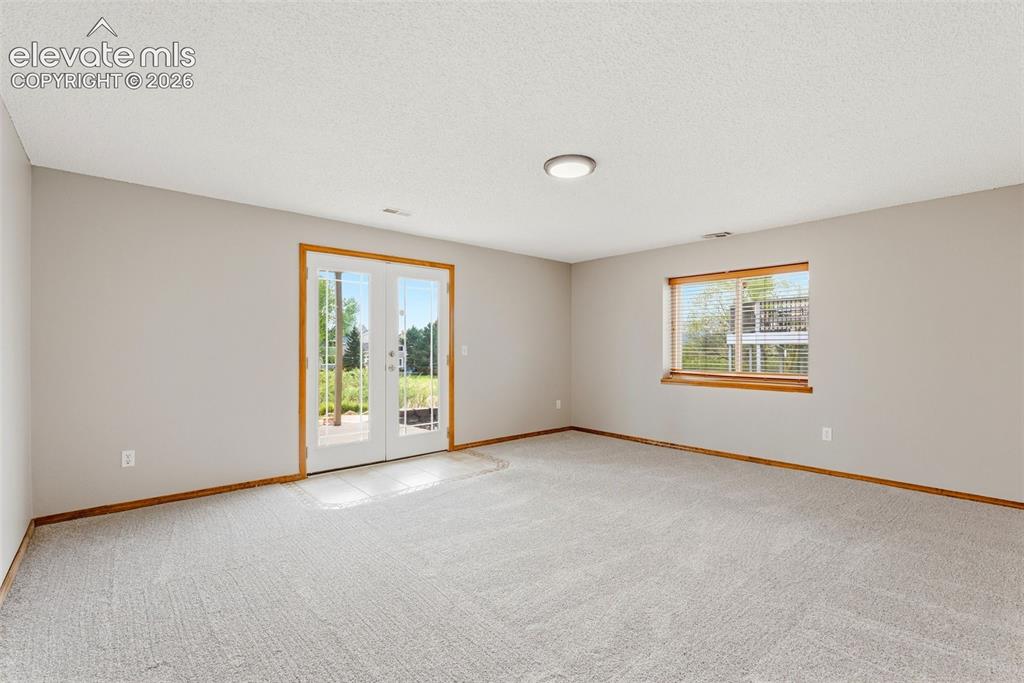 Image 44 of 50: Family Room / Rec Room with walkout to patio