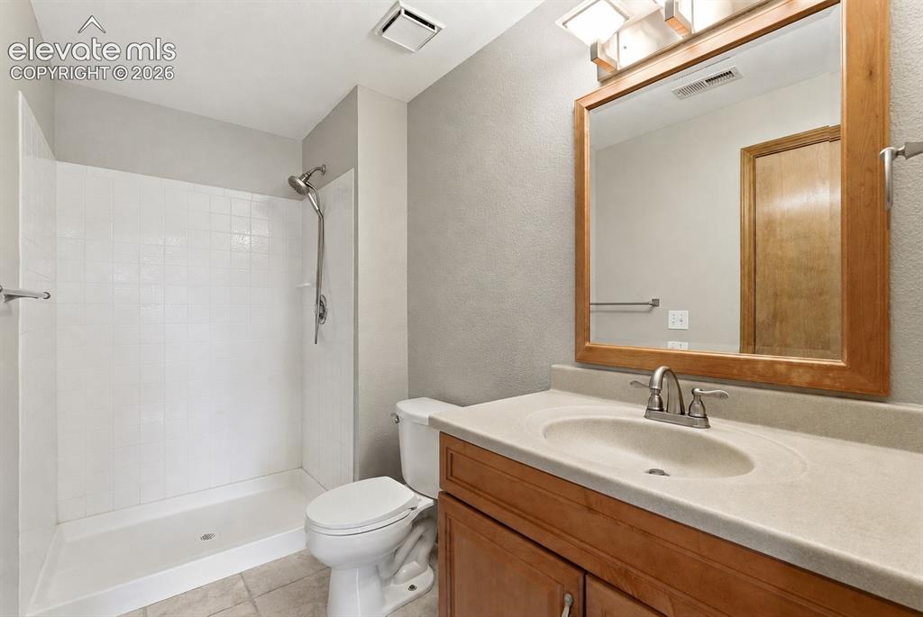 Image 47 of 50: Basement bathroom adjoining 4th bedroom