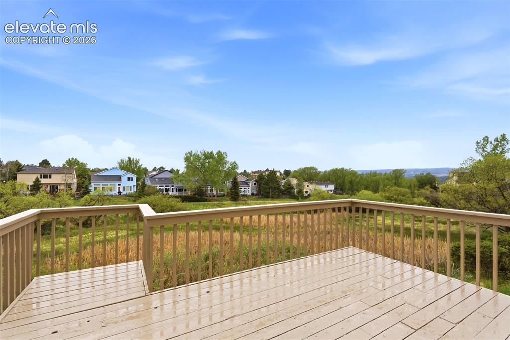 Image 5 of 50: Deck with open space and massive mountain views