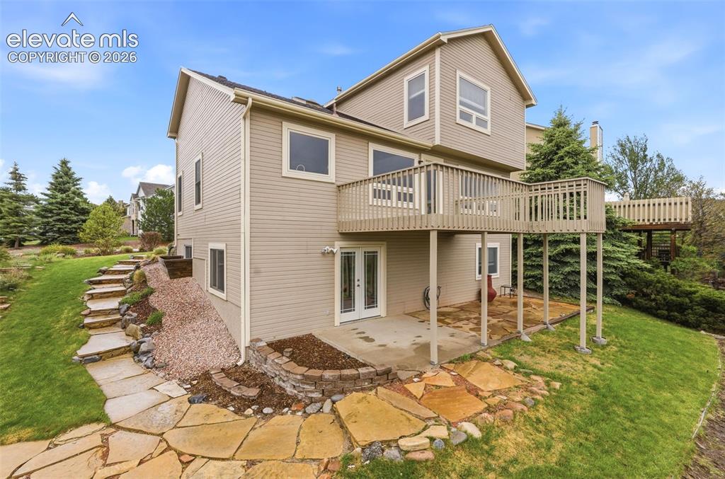 Image 7 of 50: Professionally landscaped with multiple outdoor living spaces