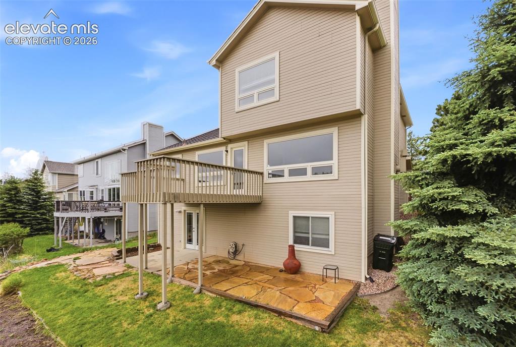 Image 8 of 50: Professionally landscaped with multiple outdoor living spaces