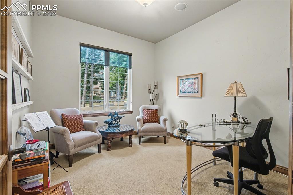 Image 14 of 42: Work from home effortlessly in the dedicated main-floor office, accompanied