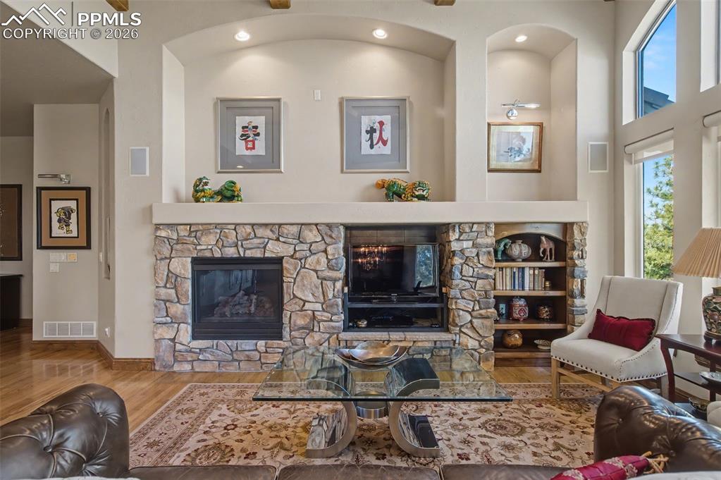 Image 8 of 42: Custom built-ins and exquisite detailing make this living area the perfect 