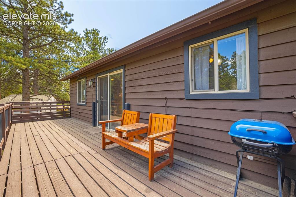 Image 34 of 41: Back deck and window to the Kitchen