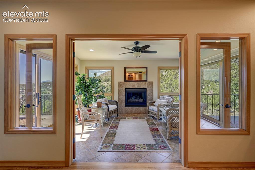 Image 17 of 47: Sun Room with access to both decks