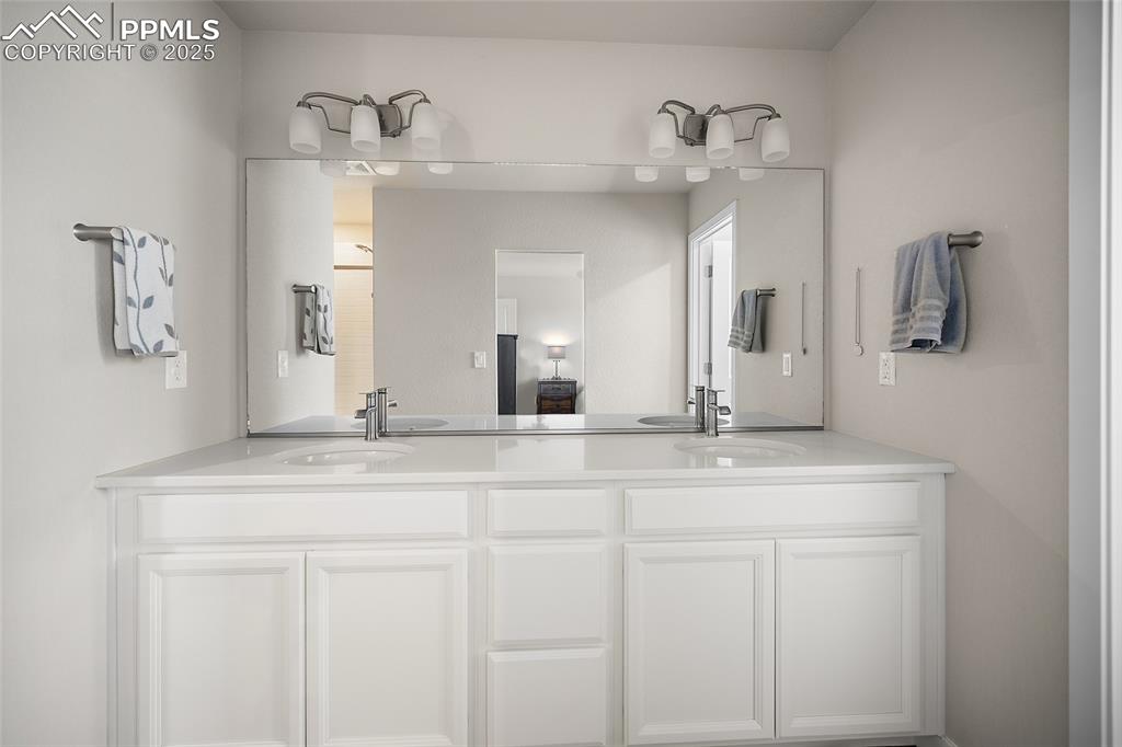 Image 23 of 41: Full bathroom featuring double vanity
