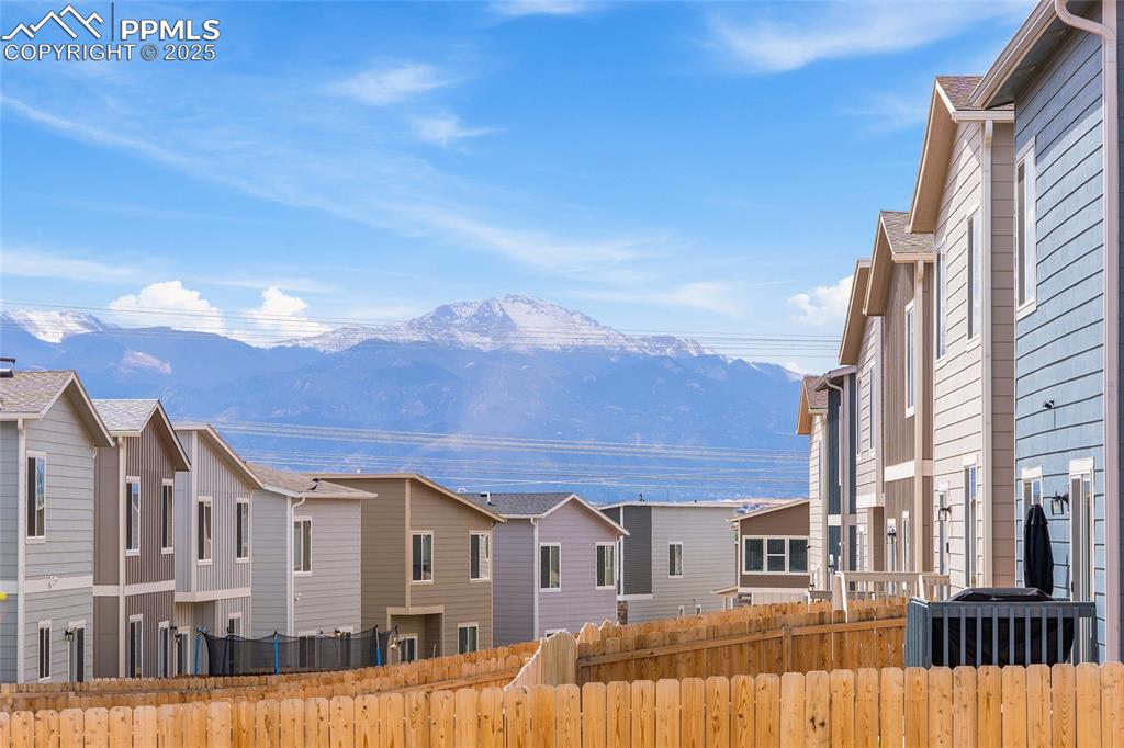 Image 4 of 41: View of mountain background with nearby suburban area