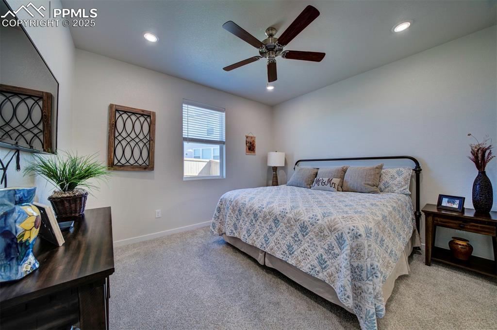 Image 14 of 42: Bedroom with light colored carpet, baseboards, recessed lighting, and ceili