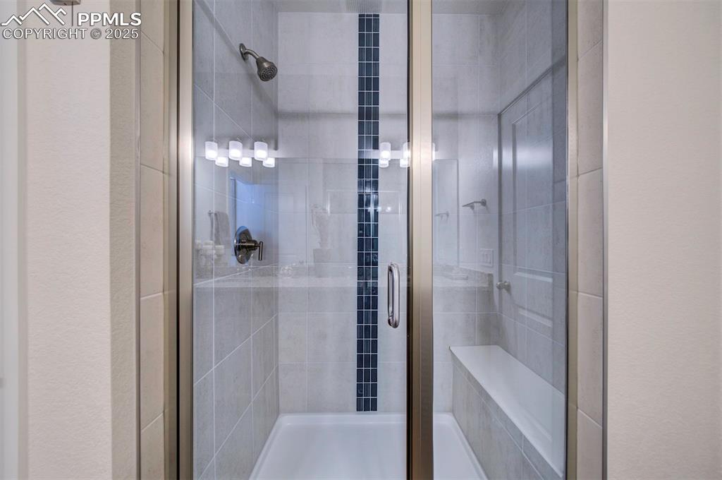Image 17 of 42: Full bath with a shower stall